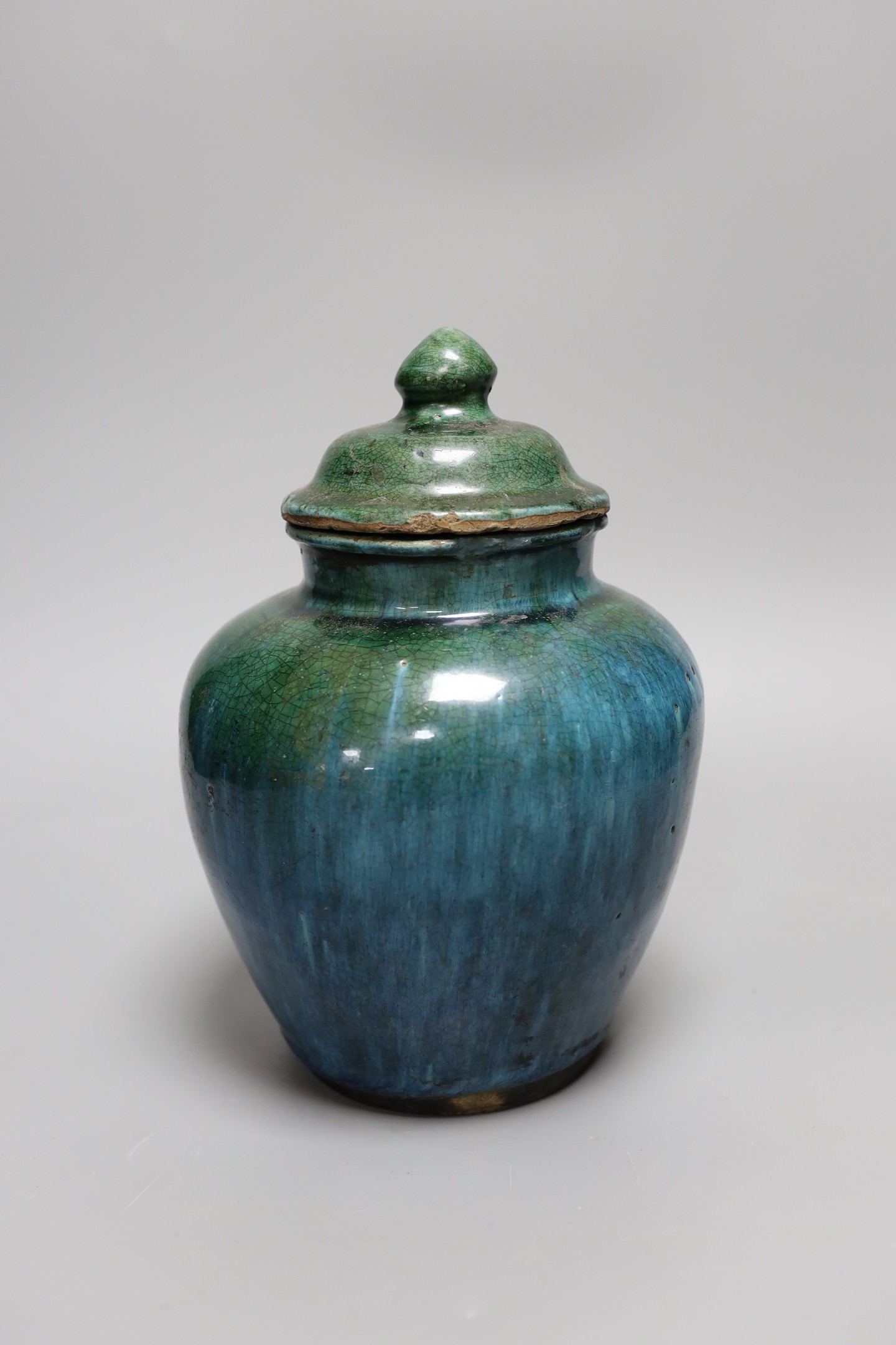A Chinese mottle glazed terracotta jar and cover, 19th century, 24 cms high